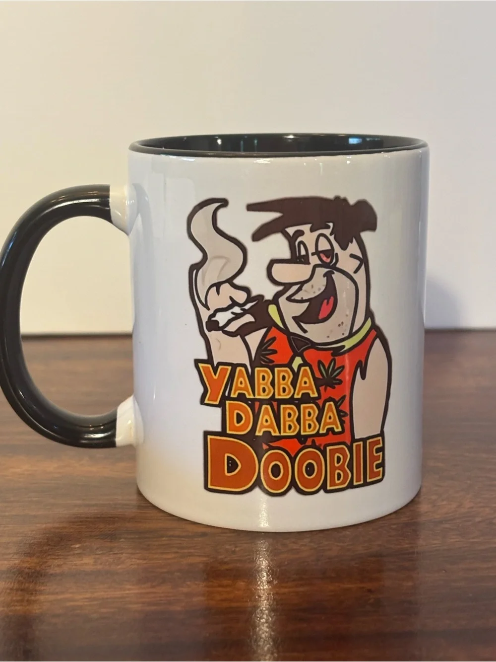 Novelty White Ceramic Coffee Mug with Black Handle - Yabba Dabba Doobie Design